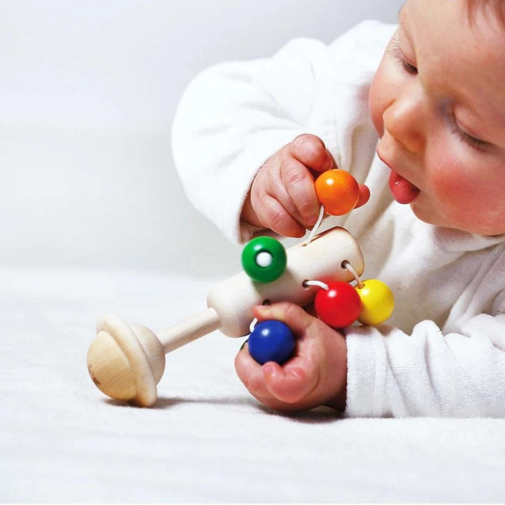 Hochet carrousel arc-en-ciel - Eveil Montessori Maroc